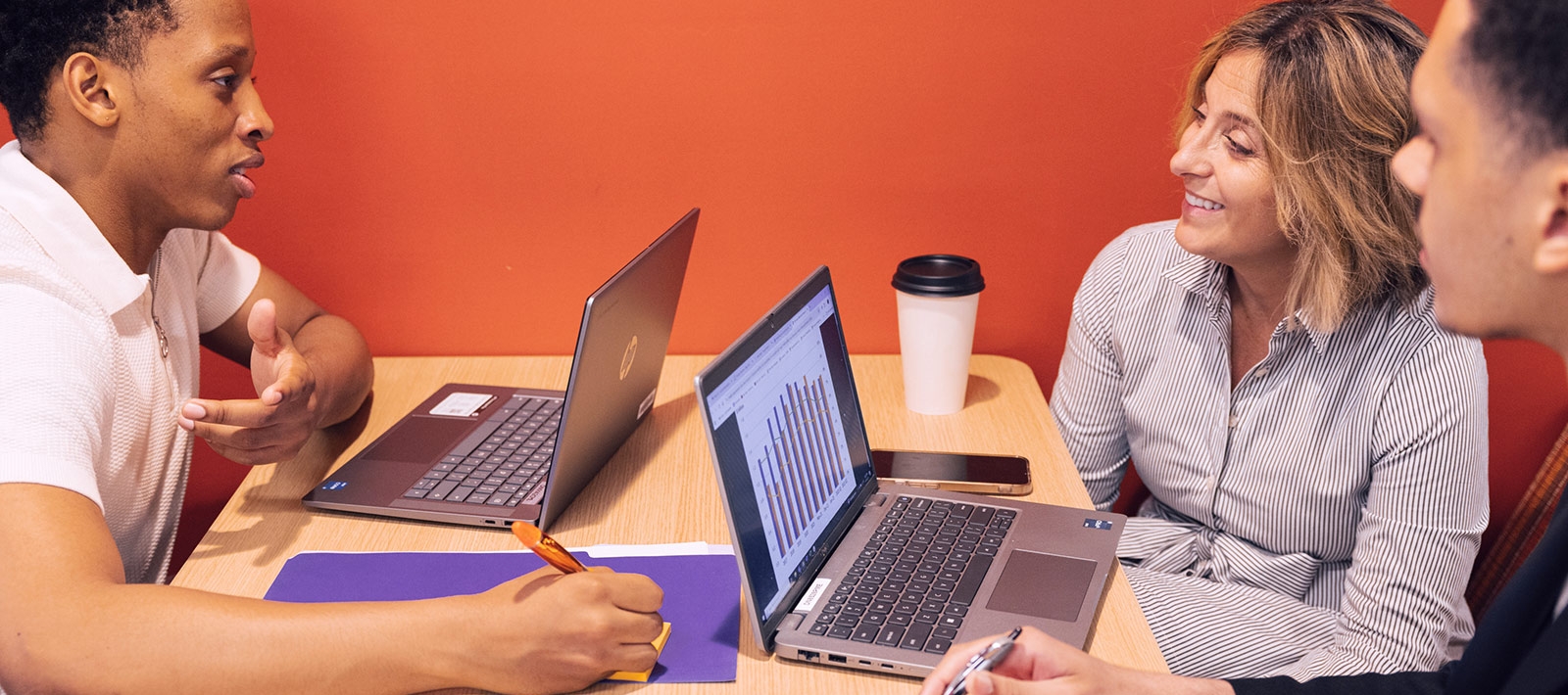 Students and faculty member having a meeting